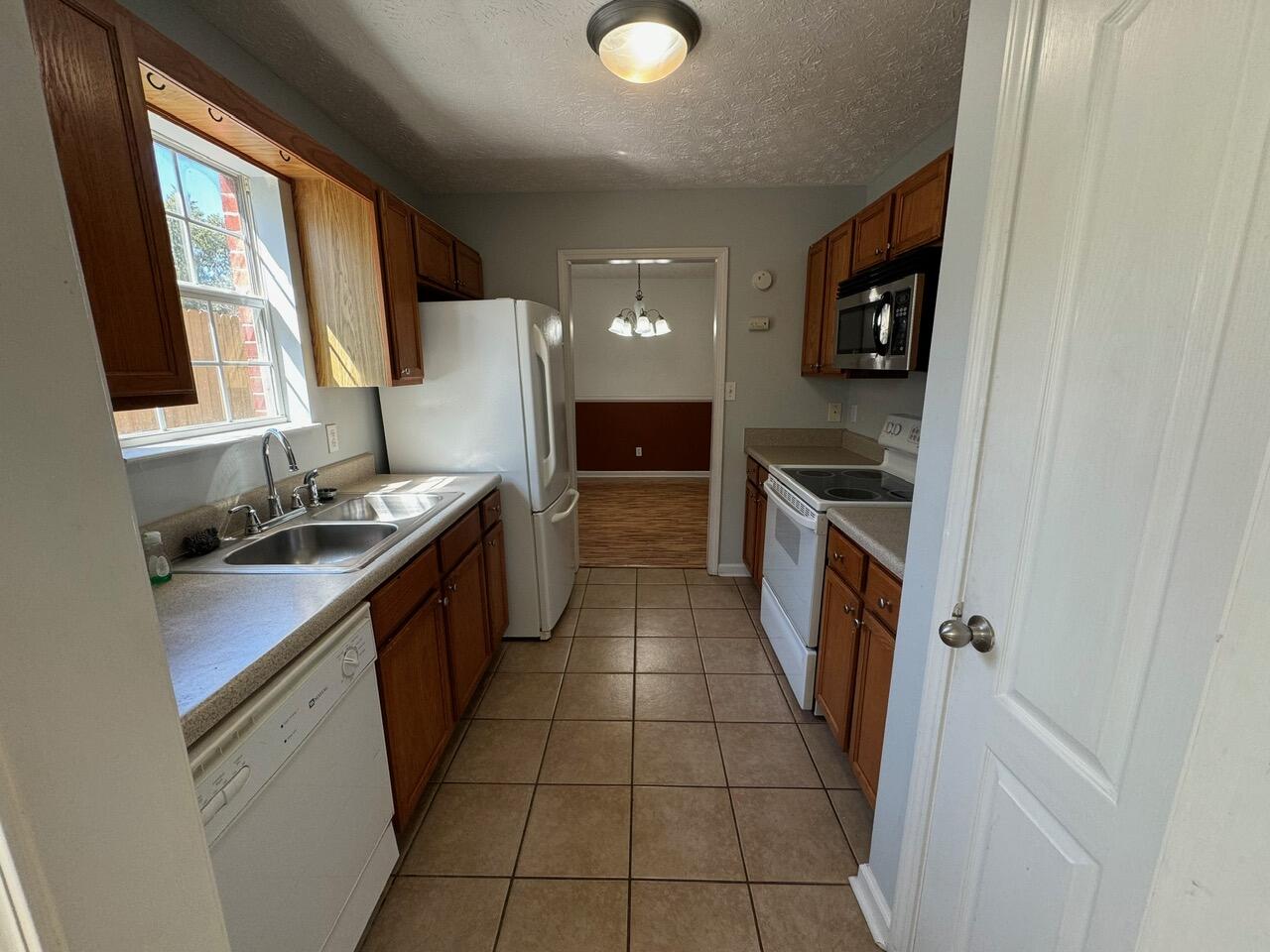 225 Bay Grove Road Freeport, FL 32439 - Photo 18 of 33 a kitchen with a sink and a stove top oven