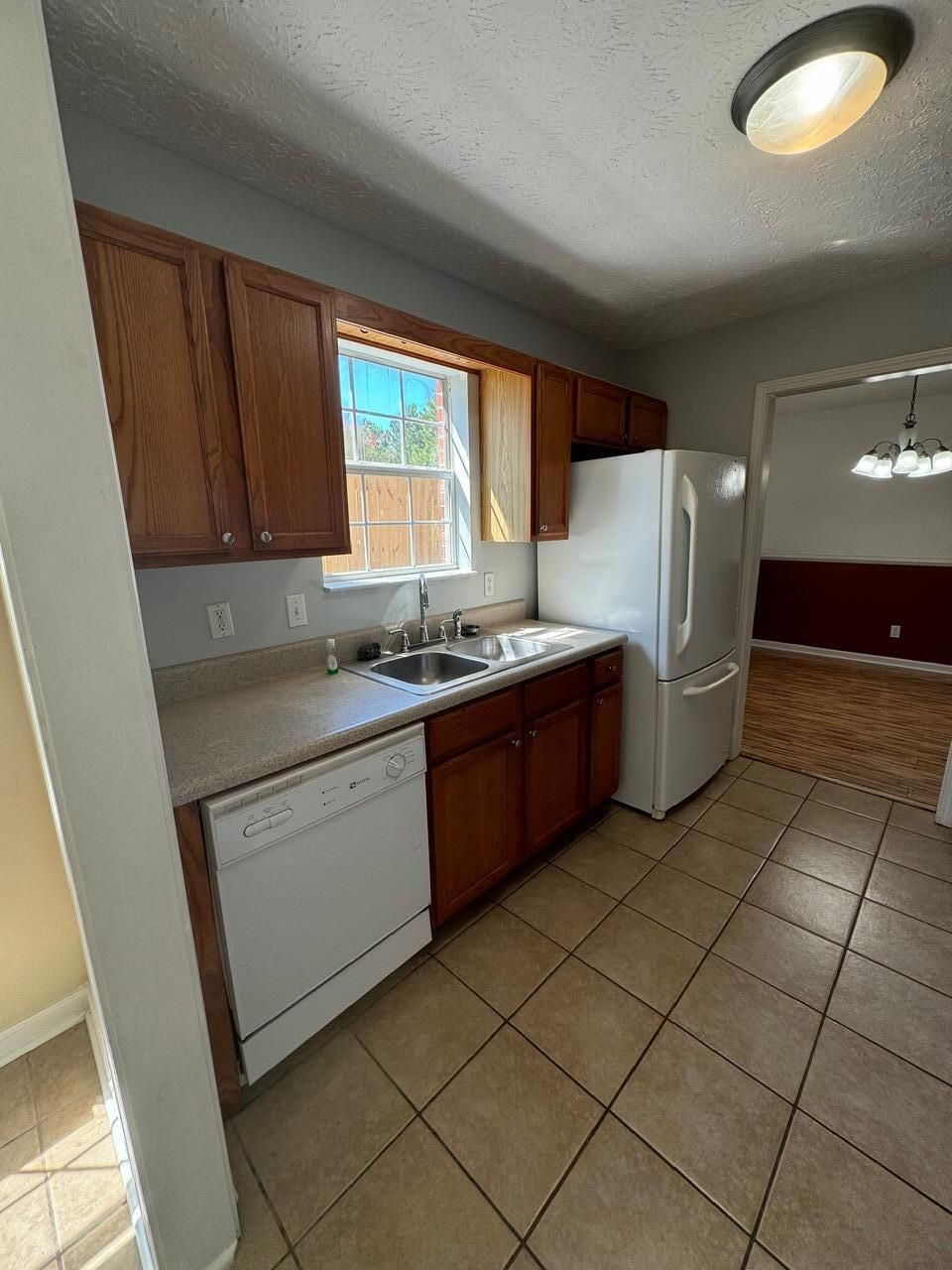 225 Bay Grove Road Freeport, FL 32439 - Photo 20 of 33 a kitchen with stainless steel appliances granite countertop a refrigerator sink and cabinets