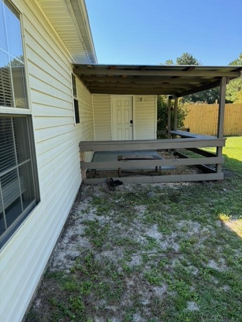 225 Bay Grove Road Freeport, FL 32439 - Photo 27 of 33 a view of backyard with wooden fence