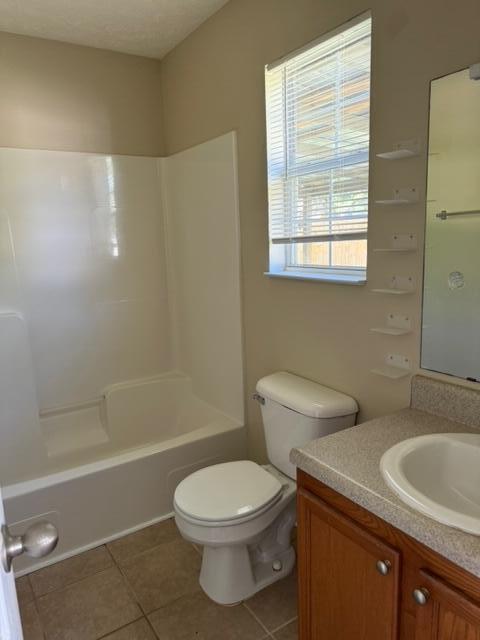 225 Bay Grove Road Freeport, FL 32439 - Photo 7 of 33 a bathroom with a toilet a sink a mirror and shower