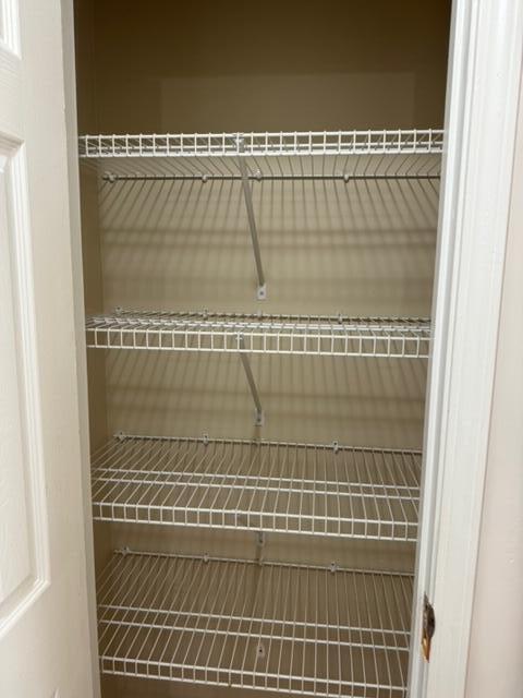 225 Bay Grove Road Freeport, FL 32439 - Photo 9 of 33 a bathroom with a glass shower door