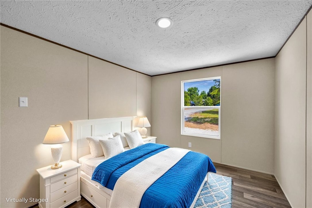 2919 High Shoals Road Anderson, SC 29624 - Photo 14 of 21 This restful bedroom features a large window offering verdant views and ample natural light.