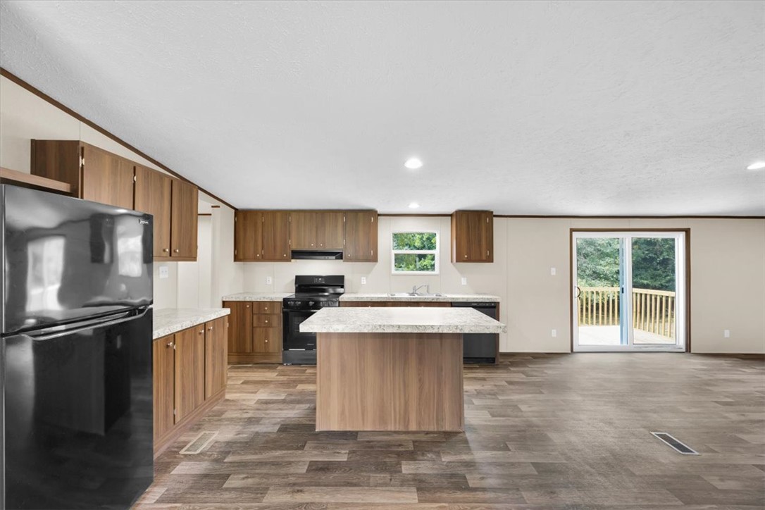 2919 High Shoals Road Anderson, SC 29624 - Photo 5 of 21 This spacious kitchen offers a functional island and access to outdoor living.