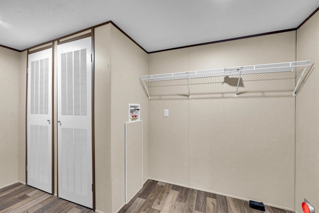 2919 High Shoals Road Anderson, SC 29624 - Photo 7 of 21 Functional laundry space with convenient shelving for organization and daily tasks.