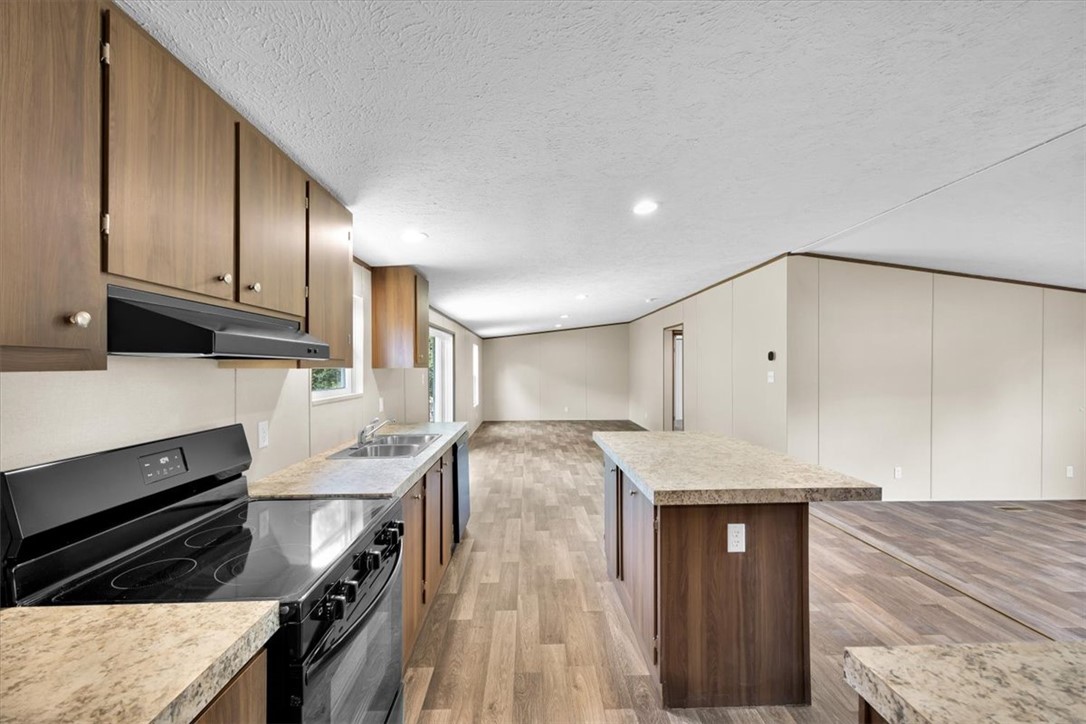 2919 High Shoals Road Anderson, SC 29624 - Photo 8 of 21 This spacious kitchen with an island flows into an inviting living area, perfect for entertaining.