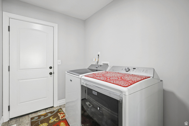 1588 West Rim Rock Drive Stockton, UT 84071 - Photo 15 of 61 Laundry area featuring light gray wall paint and wood-finish flooring