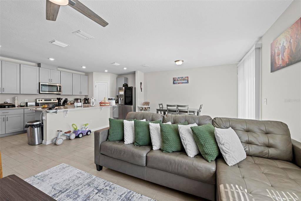 12354 Huron Street Spring Hill, FL 34609 - Photo 18 of 48 a living room with furniture and kitchen view