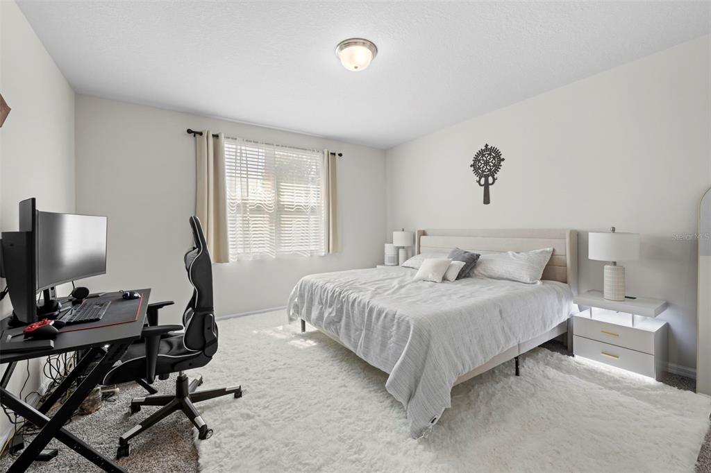 12354 Huron Street Spring Hill, FL 34609 - Photo 20 of 48 a bedroom with a bed and a window