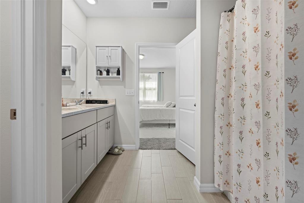 12354 Huron Street Spring Hill, FL 34609 - Photo 27 of 48 a bathroom with a sink and a mirror