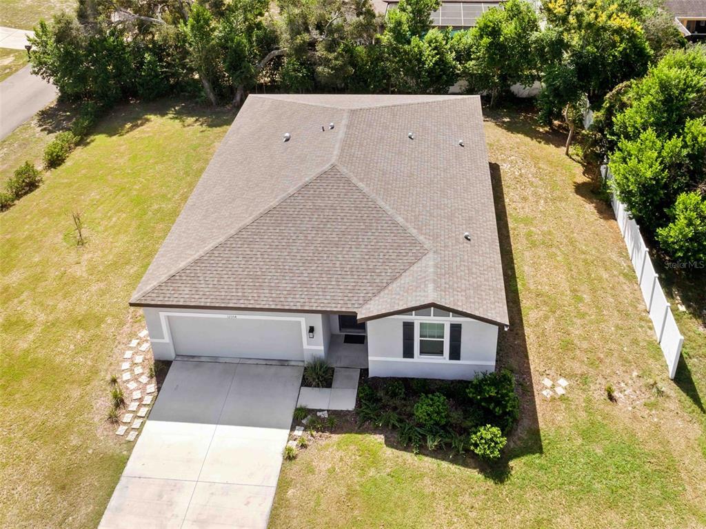 12354 Huron Street Spring Hill, FL 34609 - Photo 28 of 48 a aerial view of a house with a yard and large tree