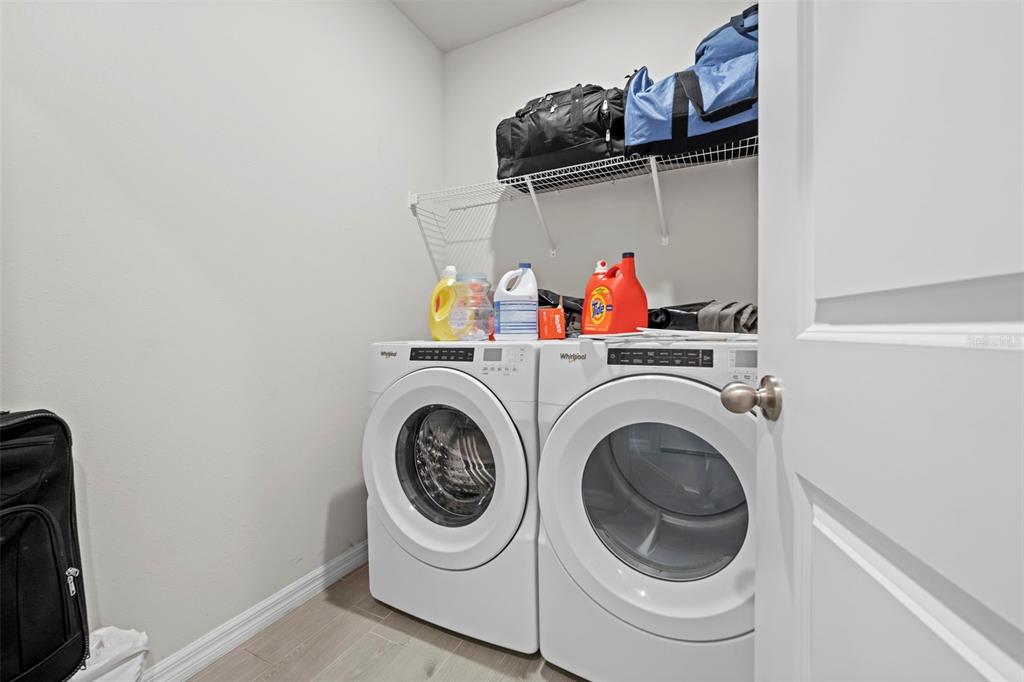 12354 Huron Street Spring Hill, FL 34609 - Photo 30 of 48 a utility room with dryer and washer