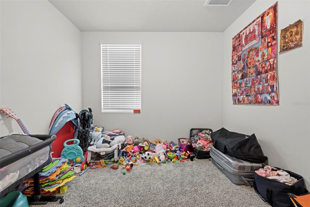 12354 Huron Street Spring Hill, FL 34609 - Photo 44 of 48 a room with toys and a small space