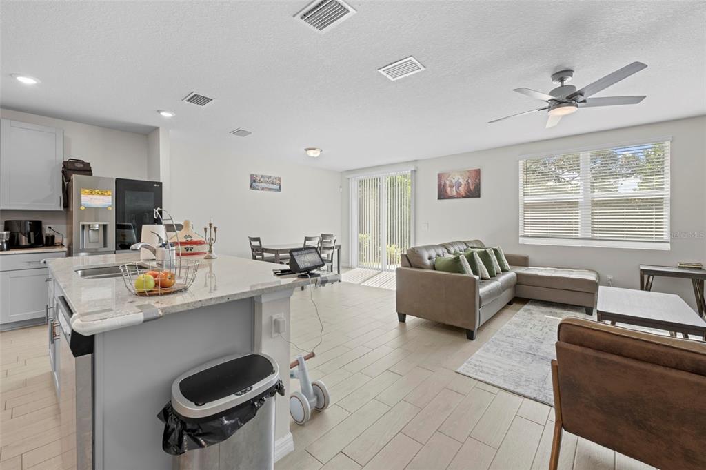 12354 Huron Street Spring Hill, FL 34609 - Photo 7 of 48 a living room with furniture and a large window