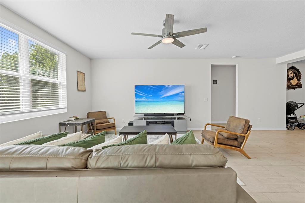 12354 Huron Street Spring Hill, FL 34609 - Photo 8 of 48 a living room with furniture and a window