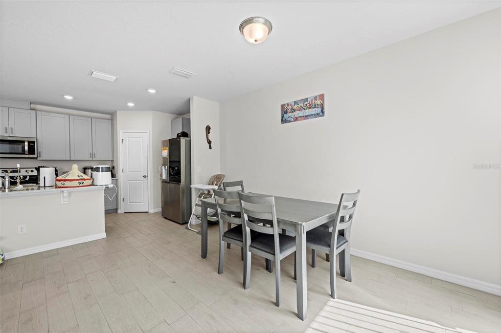 12354 Huron Street Spring Hill, FL 34609 - Photo 9 of 48 a view of a dining room with furniture