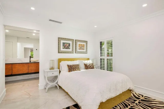 a bedroom with a bed and a couch