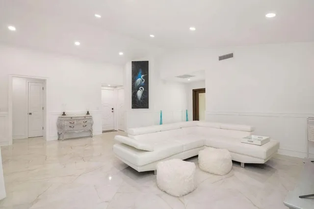 a spacious bedroom with a bed and a couch