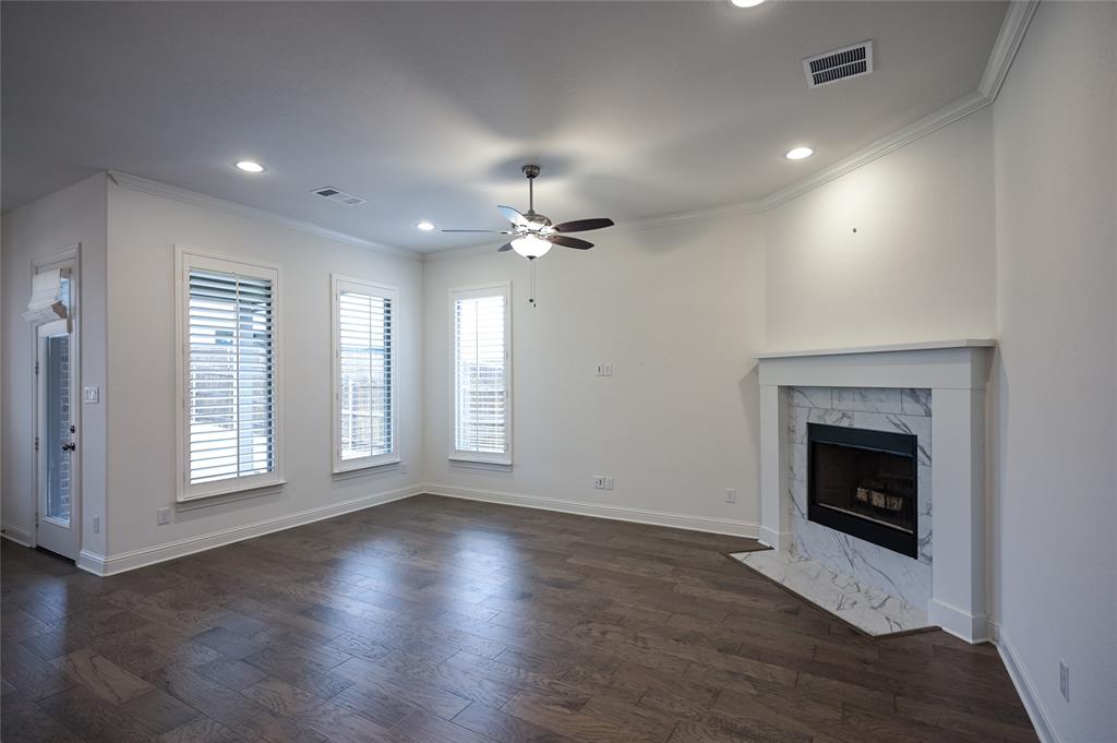 809 Deleon Drive Midlothian, TX 76065 - Photo 13 of 30 Living room with Plantation Shutters, a fireplace, wood-style flooring, recessed lighting, and a ceiling fan
