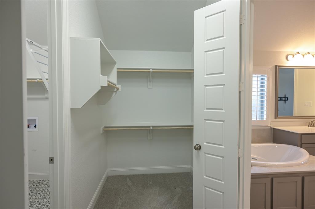 809 Deleon Drive Midlothian, TX 76065 - Photo 22 of 30 Walk in closet connects to the Laundry Room