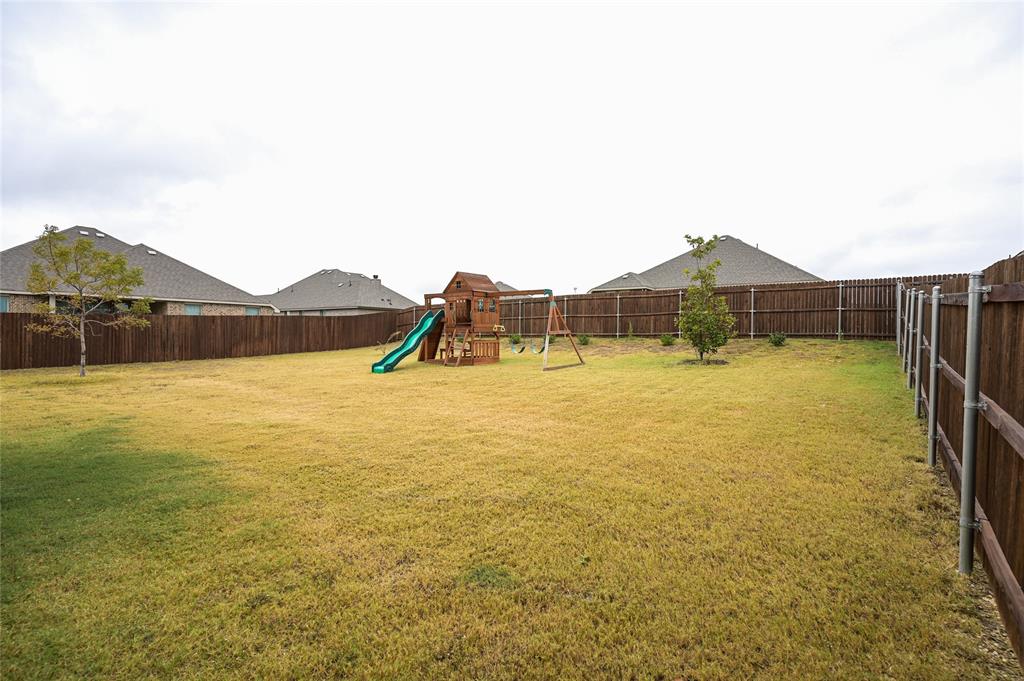 809 Deleon Drive Midlothian, TX 76065 - Photo 29 of 30 Fenced backyard with a playground