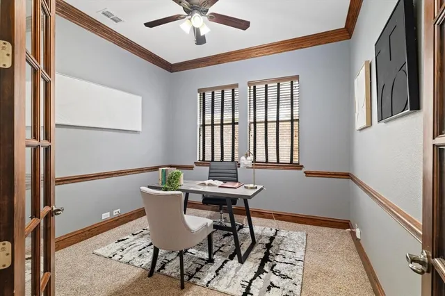 a view of a room with a table and chairs
