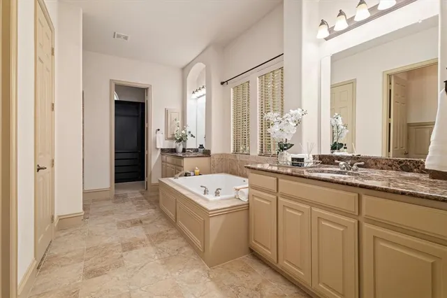 a spacious bathroom with a double vanity sink mirror and