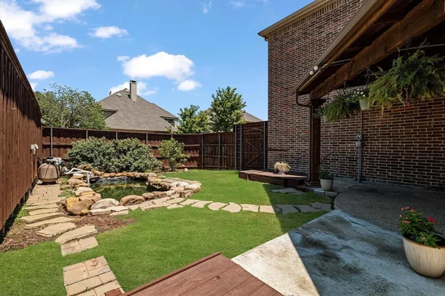 a view of yard with patio
