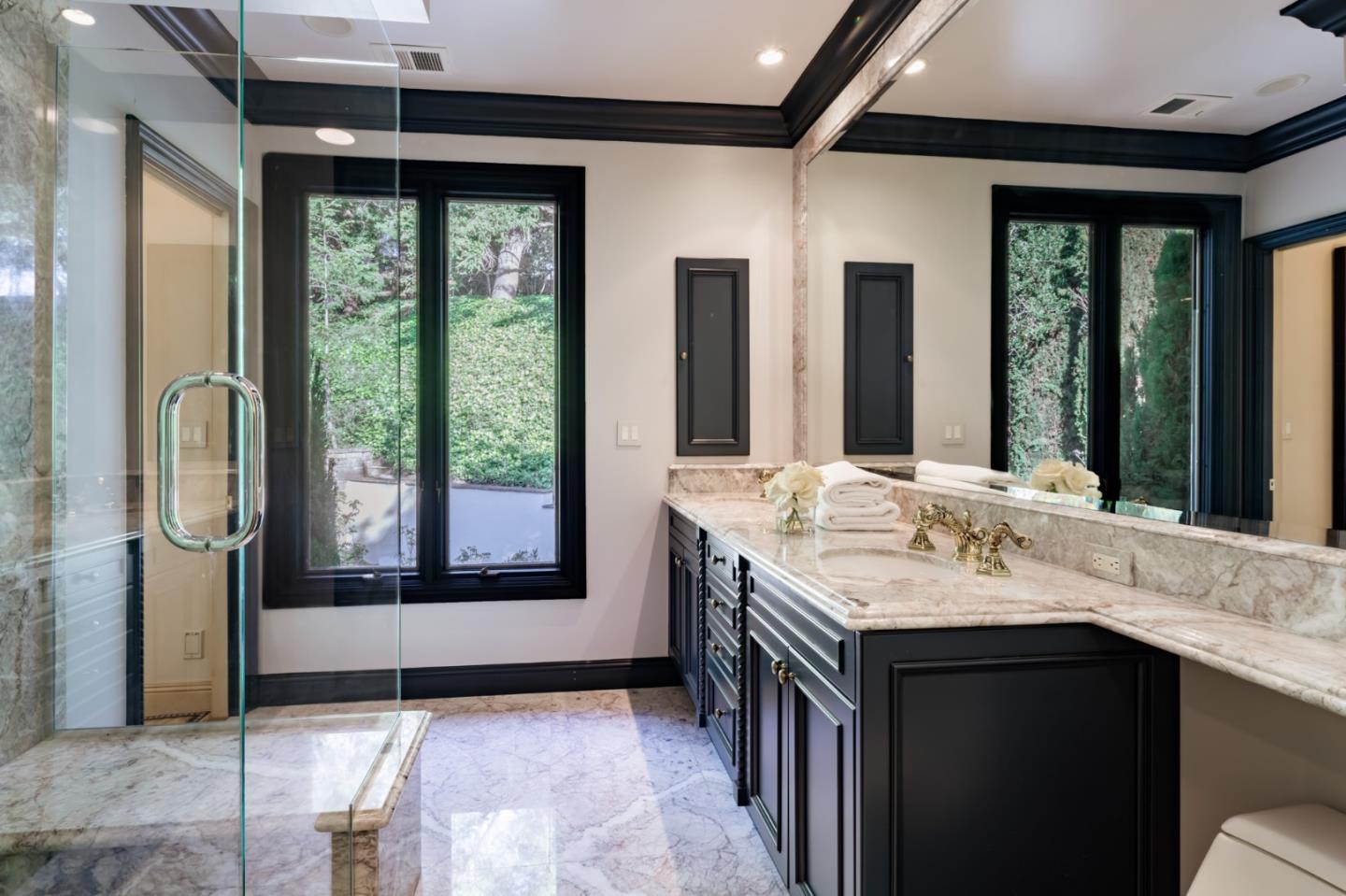 97 Ridge View Drive Atherton, CA 94027 - Photo 20 of 43 a bathroom with a granite countertop sink and a mirror