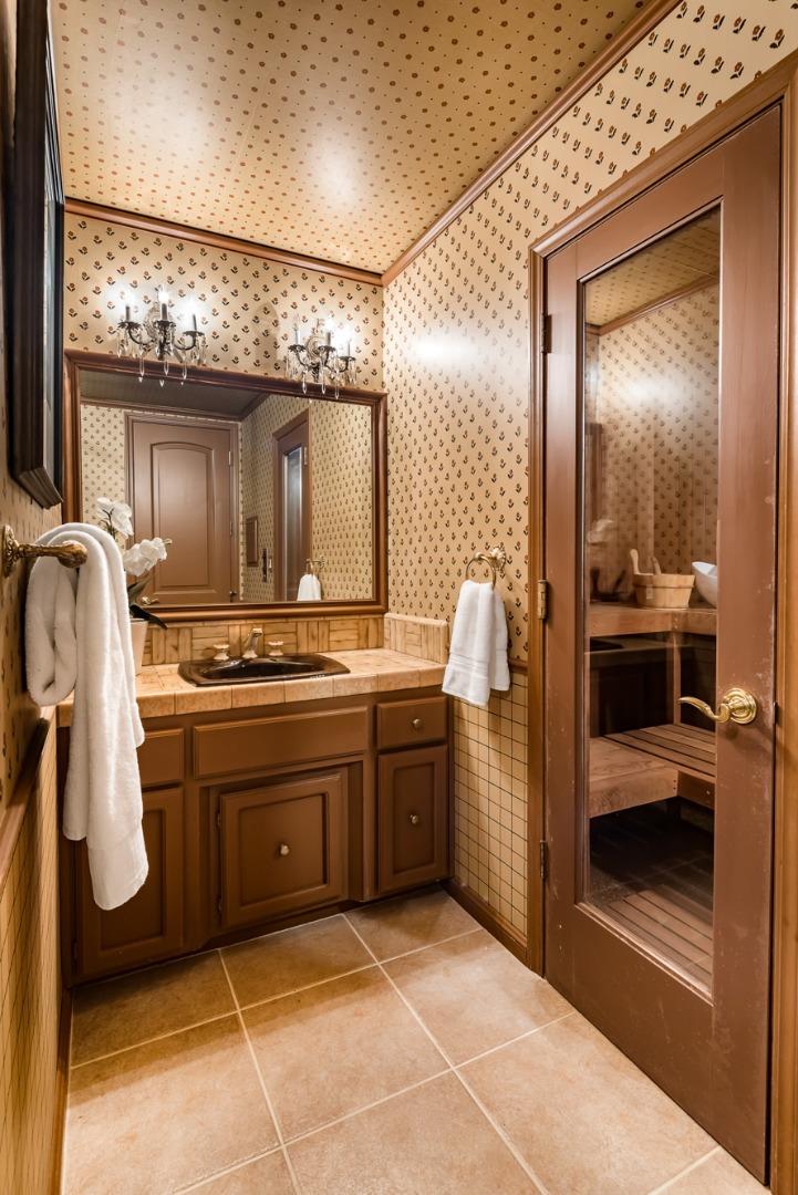 97 Ridge View Drive Atherton, CA 94027 - Photo 22 of 43 a bathroom with a sink a toilet and mirror