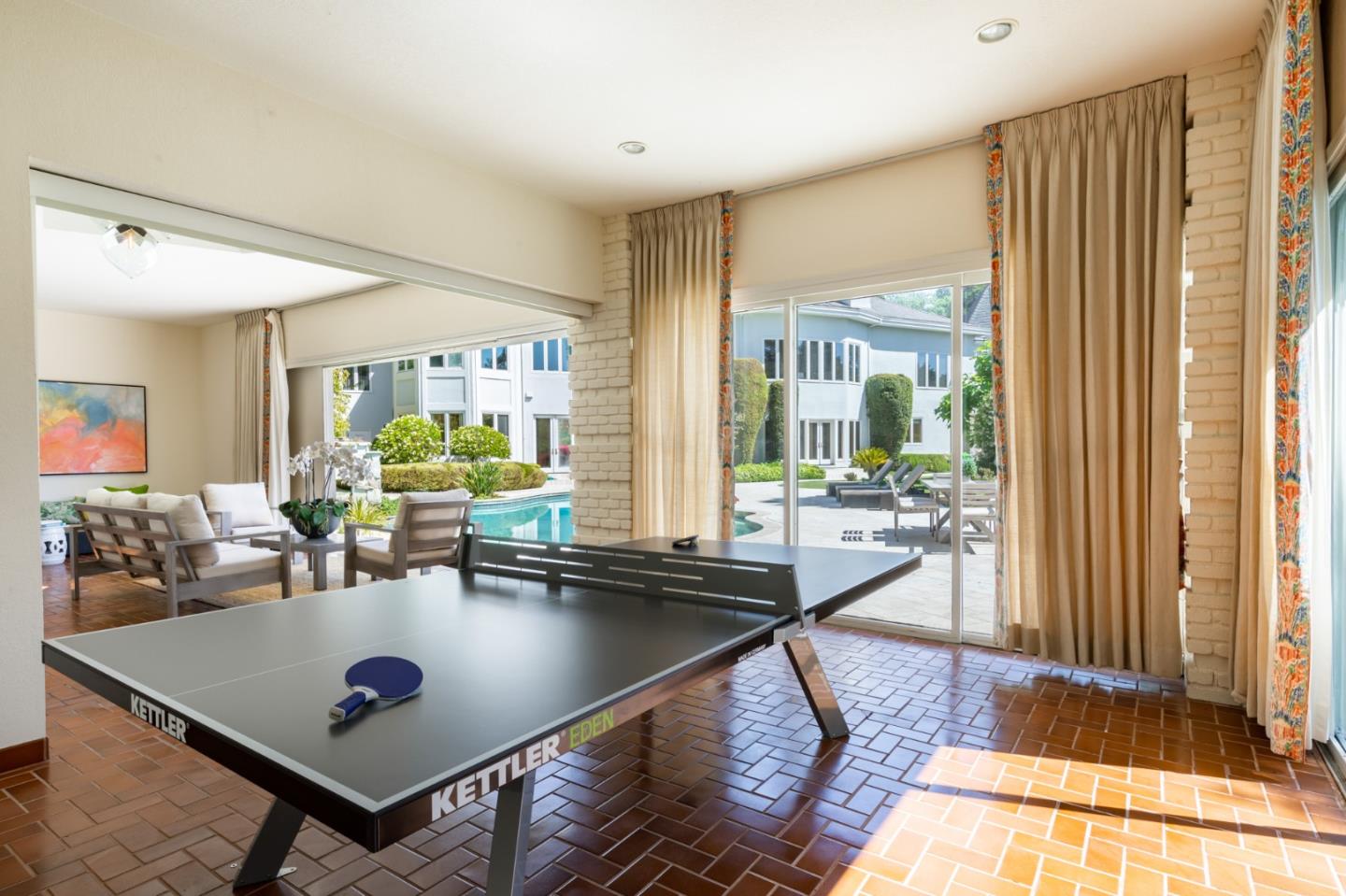 97 Ridge View Drive Atherton, CA 94027 - Photo 39 of 43 a living room with a table and a potted plant