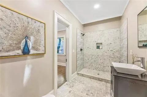 a bathroom with a shower and a sink