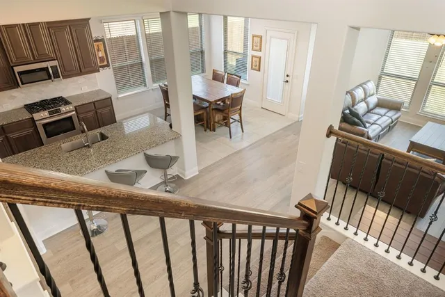 a bedroom with a bed tv and a window