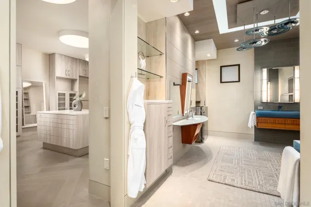 a bathroom with a double vanity sink a mirror and a shower