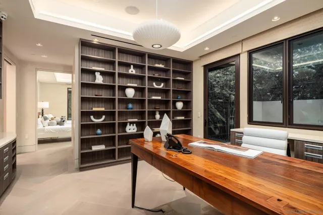 a view of living room with furniture and floor to ceiling window