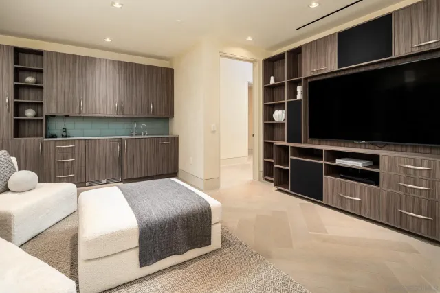 a bedroom with a bed and a television in it