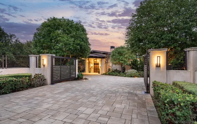 a view of a house with a yard and garage