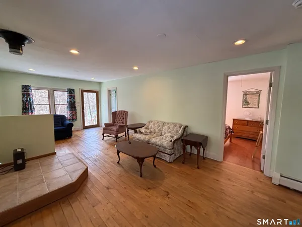 a bedroom with bed and a window