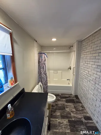 a view of a livingroom with furniture and window