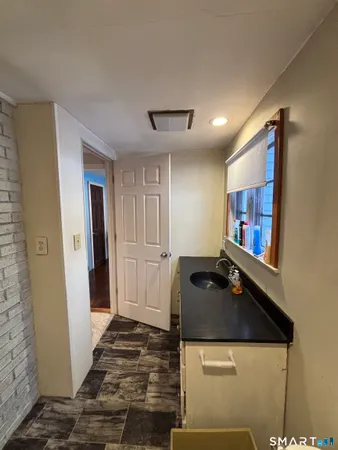 a view of a workspace room with wooden floor