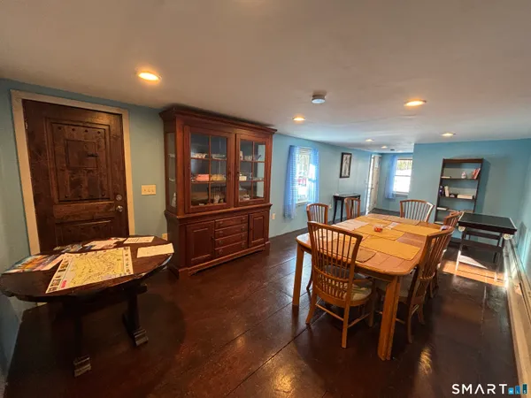 a dining room with furniture and window