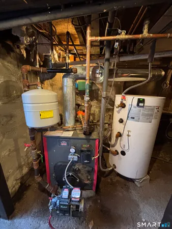 a utility room with dryer washer and other items