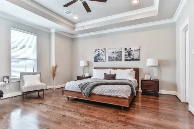 a spacious bedroom with a bed and window