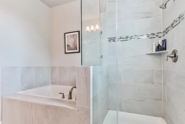 a white bath tub and a toilet