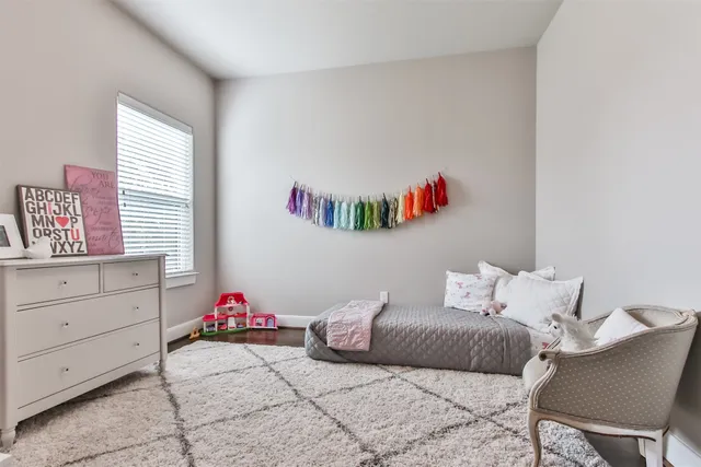 a bathroom with a bathtub a sink a toilet and a window