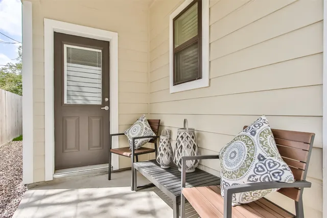 a view of a door and chair in the balcony