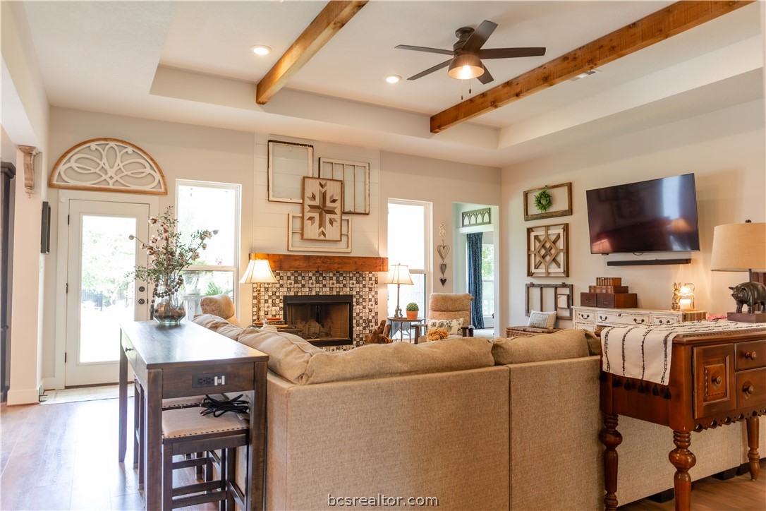 5036 Glory Road Bryan, TX 77808 - Photo 11 of 50 Raised ceiling complimented with stained cedar beams, natural light beams into room