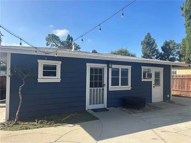 a view of a house with large windows