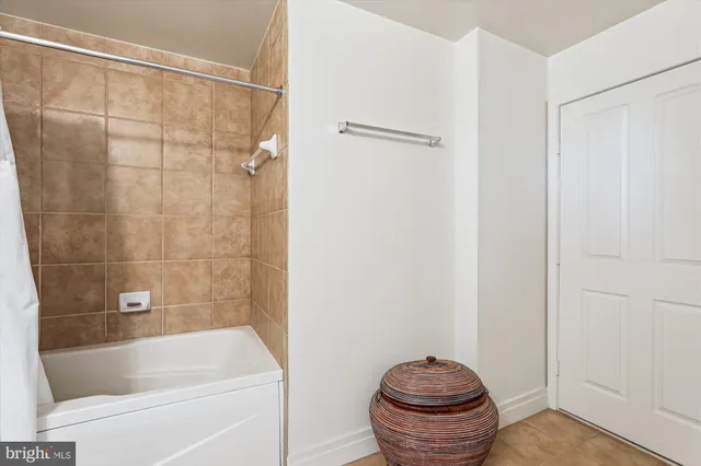 a bathroom with a shower and a toilet