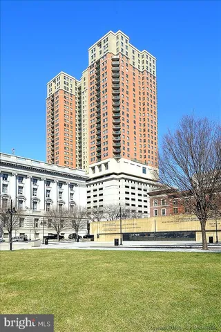 a view of a large building with a yard