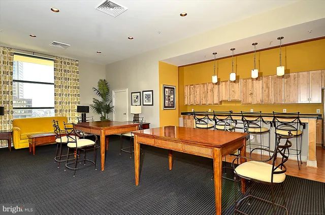 a room with a table and chairs